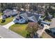 Aerial view showing a house with a gray roof, and a basketball hoop at 4216 Se 7Th Pl, Ocala, FL 34471