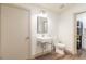 Simple bathroom with toilet and floating sink vanity at 4216 Se 7Th Pl, Ocala, FL 34471