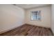 Simple bedroom with hardwood floors and a window with blinds at 4216 Se 7Th Pl, Ocala, FL 34471