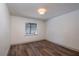 Charming bedroom featuring hardwood floors and a window with blinds at 4216 Se 7Th Pl, Ocala, FL 34471