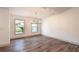 Bright dining room featuring hardwood floors and large windows at 4216 Se 7Th Pl, Ocala, FL 34471