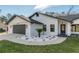 Modern home with white exterior, gray garage door, and walkway at 4216 Se 7Th Pl, Ocala, FL 34471