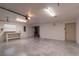 Large garage featuring a workbench and storage shelving at 4216 Se 7Th Pl, Ocala, FL 34471