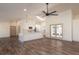 Open concept kitchen with white cabinets, large island and stainless steel appliances at 4216 Se 7Th Pl, Ocala, FL 34471