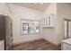 Kitchen nook with white cabinets and window overlooking backyard at 4216 Se 7Th Pl, Ocala, FL 34471