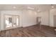 Large main bedroom with hardwood floors and access to the screened porch at 4216 Se 7Th Pl, Ocala, FL 34471