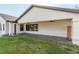 Covered patio with stamped concrete and a wooden screen at 4216 Se 7Th Pl, Ocala, FL 34471