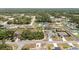 Areal view of the neighborhood showcasing a mix of homes with well-maintained lawns and tree coverage at 4393 Sw 169 Lane Rd, Ocala, FL 34473