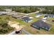 Residential street lined with homes, landscaping, and local amenities, near green spaces and paved roads at 4393 Sw 169 Lane Rd, Ocala, FL 34473