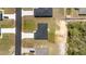 Aerial view of a modern home featuring fresh landscaping, a paved driveway, and a dark roof at 4393 Sw 169 Lane Rd, Ocala, FL 34473