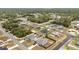 Expansive aerial view showcasing a well-planned community with tree-lined streets and neatly maintained homes at 4393 Sw 169 Lane Rd, Ocala, FL 34473
