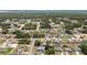 A high angle shot of residences nestled between trees and foliage in a quiet neighborhood setting at 4393 Sw 169 Lane Rd, Ocala, FL 34473