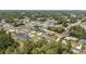 Aerial view of a residential neighborhood with mature trees, single Gathering homes, and paved streets at 4393 Sw 169 Lane Rd, Ocala, FL 34473