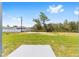 Backyard with fresh green grass, space for entertaining, and space for gardening at 4393 Sw 169 Lane Rd, Ocala, FL 34473