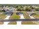 New construction single Gathering homes feature green lawns, paved driveways, and a community of similar homes at 4393 Sw 169 Lane Rd, Ocala, FL 34473