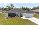 Newly built single-Gathering home with a two car garage and manicured front lawn at 4393 Sw 169 Lane Rd, Ocala, FL 34473