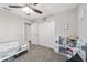 Bedroom with twin bed, closet, and toy kitchen at 4955 Se 89Th Place Rd, Ocala, FL 34480