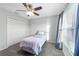 Bedroom with twin bed, ceiling fan, and double door closet at 4955 Se 89Th Place Rd, Ocala, FL 34480