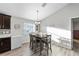 Kitchen dining area with wood table and chairs, great natural light at 4955 Se 89Th Place Rd, Ocala, FL 34480