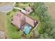 Aerial view showcasing house and pool area at 7451 Se 24Th Ter, Ocala, FL 34480