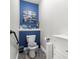 Small bathroom with blue walls and seashell decor at 7451 Se 24Th Ter, Ocala, FL 34480