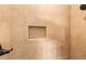 Shower with beige tile and niche at 7451 Se 24Th Ter, Ocala, FL 34480