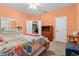 Bedroom with a floral comforter and a ceiling fan at 7451 Se 24Th Ter, Ocala, FL 34480