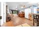 Living room with wood floors, ceiling fan, and sliding glass doors at 7451 Se 24Th Ter, Ocala, FL 34480