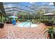 Aerial view of a beautiful pool and screened enclosure at 7451 Se 24Th Ter, Ocala, FL 34480