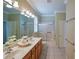 Bathroom boasts double sinks, shower, and tub at 8852 Se 119Th St, Summerfield, FL 34491