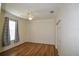 Well-lit bedroom with wood-look floors and window at 8852 Se 119Th St, Summerfield, FL 34491