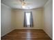 Bedroom with wood-look floors and ceiling fan at 8852 Se 119Th St, Summerfield, FL 34491