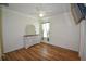 Bedroom with wood-look floors and a dresser with mirror at 8852 Se 119Th St, Summerfield, FL 34491