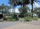 Community clubhouse with palm trees and landscaped grounds at 8852 Se 119Th St, Summerfield, FL 34491