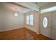 Bright dining room with hardwood floors, crown molding, and a chandelier at 8852 Se 119Th St, Summerfield, FL 34491