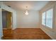 Spacious dining room featuring hardwood floors and a chandelier at 8852 Se 119Th St, Summerfield, FL 34491