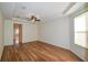 Bright Gathering room with hardwood floors and ceiling fan at 8852 Se 119Th St, Summerfield, FL 34491