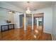 Elegant hallway with hardwood floors and access to other rooms at 8852 Se 119Th St, Summerfield, FL 34491