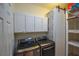 Updated laundry room with washer, dryer, and storage at 8852 Se 119Th St, Summerfield, FL 34491