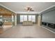 Spacious living room featuring light beige couch and tile flooring at 8852 Se 119Th St, Summerfield, FL 34491