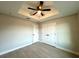 Bedroom with double door closet and wood-look flooring at 8968 Se 156Th St, Summerfield, FL 34491