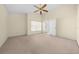 Bright and airy bedroom with carpeted floor and a window at 9260 Sw 92Nd Place Rd, Ocala, FL 34481