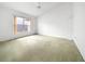 Bedroom with beige carpet and large window for natural light at 9260 Sw 92Nd Place Rd, Ocala, FL 34481