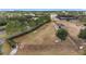 Aerial view of community's fenced dog park area with benches and play equipment at 10129 Sw 77Th Loop, Ocala, FL 34481