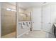 Well-lit bathroom featuring a large, glass-enclosed shower and dual-entry linen closet at 10129 Sw 77Th Loop, Ocala, FL 34481