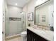 Modern bathroom with glass shower, and stylish dark wood vanity at 10129 Sw 77Th Loop, Ocala, FL 34481