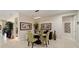 Cozy dining area featuring tile flooring, a modern light fixture, and neutral wall colors at 10129 Sw 77Th Loop, Ocala, FL 34481