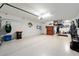 Spacious garage with epoxy flooring, overhead storage, and plenty of room at 10129 Sw 77Th Loop, Ocala, FL 34481