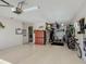 Garage with ample storage, including overhead racks and cabinets at 10129 Sw 77Th Loop, Ocala, FL 34481