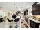 Bright kitchen with a large center island, stainless steel appliances, and tile flooring at 10129 Sw 77Th Loop, Ocala, FL 34481